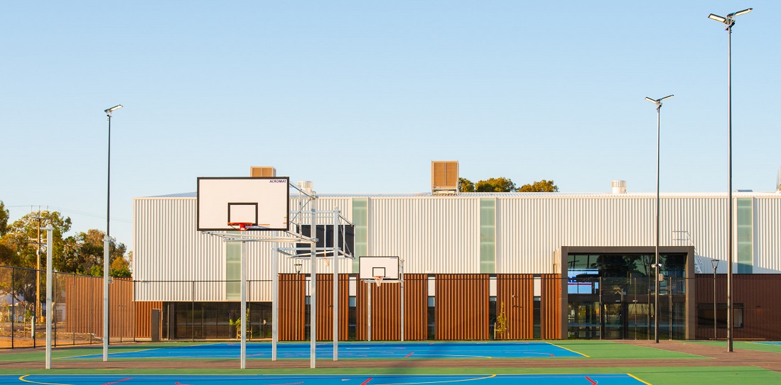 Outside sports courts with basketball hoop